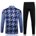 Conjunto sportswear Real Madrid 2024/25 gris